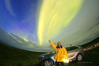 bright aurora near Husavik at
                dusk